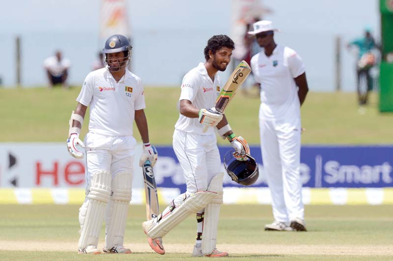 chandimal and karunaratne complimented each other superbly as they put on the highest ever partnership of any wicket in a match between sri lanka and west indies with 238 photo afp