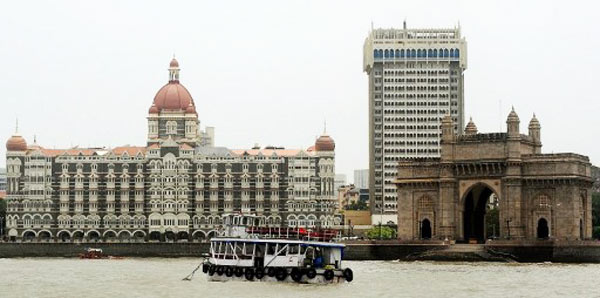 the gateway of india r and taj mahal palace and tower l photo afp