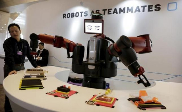 a baxter robot of rethink robotics picks up a business card as it performs during a display at the world economic forum wef in china photo reuters a baxter robot of rethink robotics picks up a business card as it performs during a display at the world economic forum wef in china photo reuters