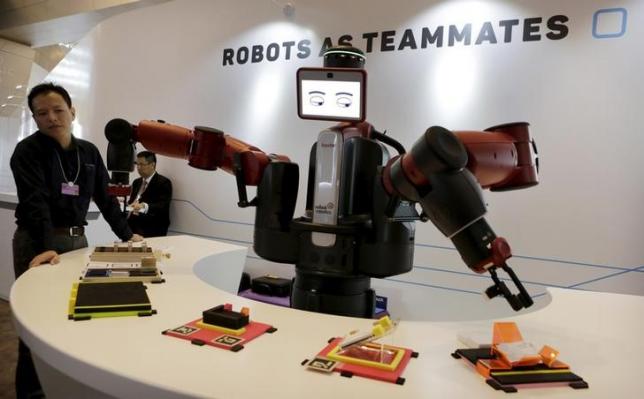 a baxter robot of rethink robotics picks up a business card as it performs during a display at the world economic forum wef in china photo reuters