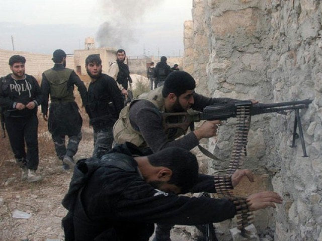 syrian rebel fighters shoot through a hole in a wall towards forces loyal to the regime in 2013 in aleppo photo afp syrian rebel fighters shoot through a hole in a wall towards forces loyal to the regime in 2013 in aleppo photo afp