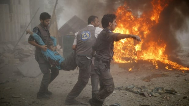 syrian emergency personnel carry a wounded man following air strikes by syrian government forces on a marketplace in the rebel held area of douma east of the capital damascus on october 11 photo afp syrian emergency personnel carry a wounded man following air strikes by syrian government forces on a marketplace in the rebel held area of douma east of the capital damascus on october 11 photo afp