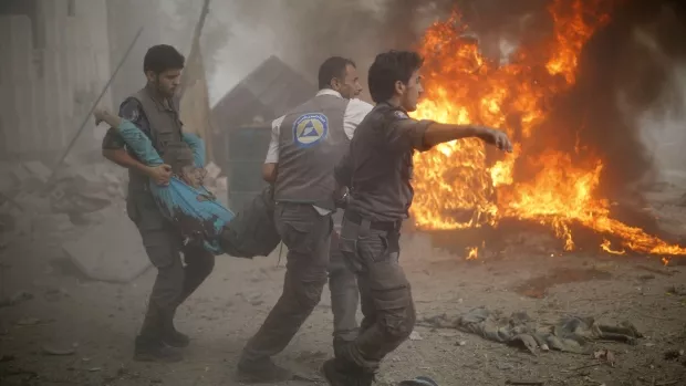 syrian emergency personnel carry a wounded man following air strikes by syrian government forces on a marketplace in the rebel held area of douma east of the capital damascus on october 11 photo afp syrian emergency personnel carry a wounded man following air strikes by syrian government forces on a marketplace in the rebel held area of douma east of the capital damascus on october 11 photo afp