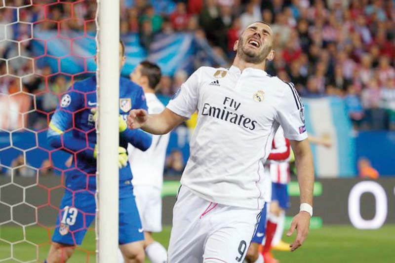 benzema is the go to man for new real coach rafa benitez but the league s top scorer is set for a spell on the sidelines after suffering an injury with france photo reuters