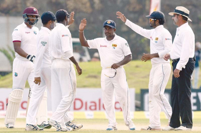 herath tormented the west indies batsmen at galle claiming a total of seven wickets in the day photo afp herath tormented the west indies batsmen at galle claiming a total of seven wickets in the day photo afp