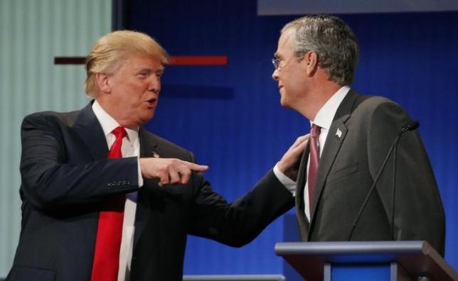 donald trump talks with fellow candidate jeb bush during a commercial break at the first official republican presidential candidates debate of the 2016 us presidential campaign in cleveland ohio august 6 2015 photo reuters