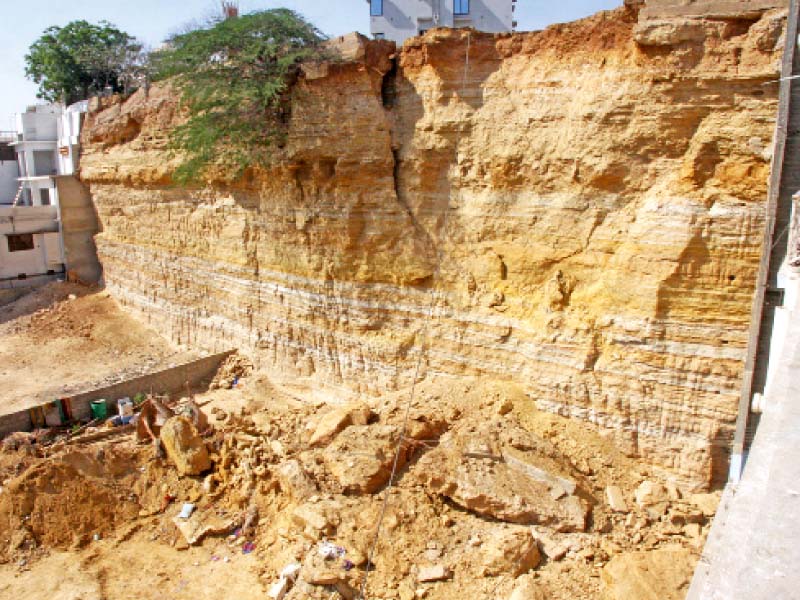 geological experts have warned against cutting hills in gulistan e jauhar at a 90 degree angle as done above on the site of the fatal landslide that killed 13 people this week they also advise against constructing on the hill but there is a two storey house perched on top of the hill above photo athar khan express