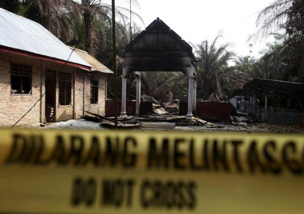 police tape blocks access to a burned church at suka makmur village in aceh singkil indonesia aceh province october 18 2015 the words on the tape read 039 do not cross 039 photo reuters