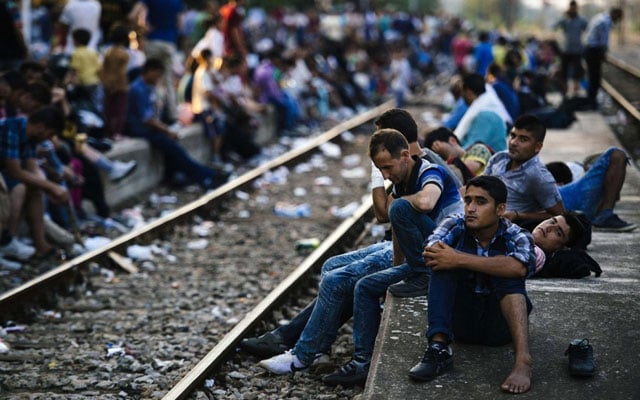 migrants wait for a train heading to serbia at the gevgelija railway station on the macedonian greek border on july 28 2015 photo afp