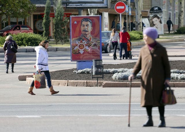 a portrait of soviet dictator josef stalin is seen displayed on an advertisement board in donetsk the rebel capital of eastern ukraine photo afp