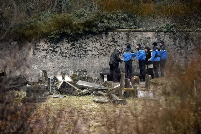 police investigate toppled tombstones at a jewish cemetery in northeastern france photo afp police investigate toppled tombstones at a jewish cemetery in northeastern france photo afp