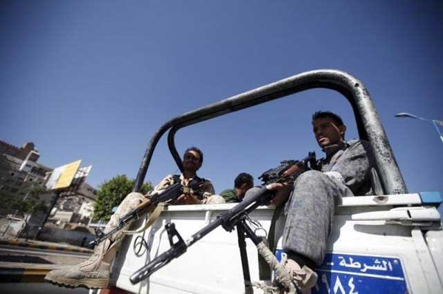 houthi fighters sit on the back of a police truck patrolling a road where people demonstrated against the saudi led air strikes in yemen 039 s capital sanaa october 18 2015 photo reuters