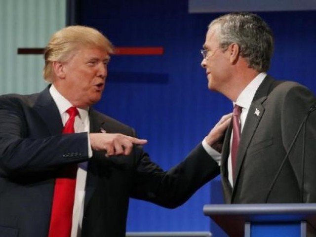 donald trump talks with fellow candidate jeb bush during a commercial break at the first official republican presidential candidates debate of the 2016 us presidential campaign in cleveland ohio august 6 2015 photo reuters