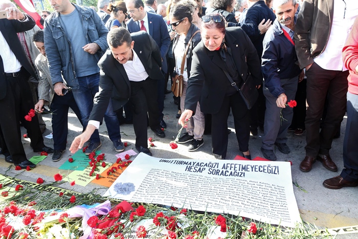 people throw roses as they attend a commemoration for the victims of the october 10 bombings in ankara on october 17 2015 photo afp