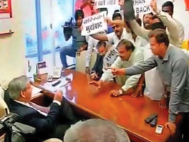 this tv grab shows shiv sena activists threatening bcci president shashank manohar to cancel talks with the pcb chief at the wankhede stadium in mumbai this tv grab shows shiv sena activists threatening bcci president shashank manohar to cancel talks with the pcb chief at the wankhede stadium in mumbai