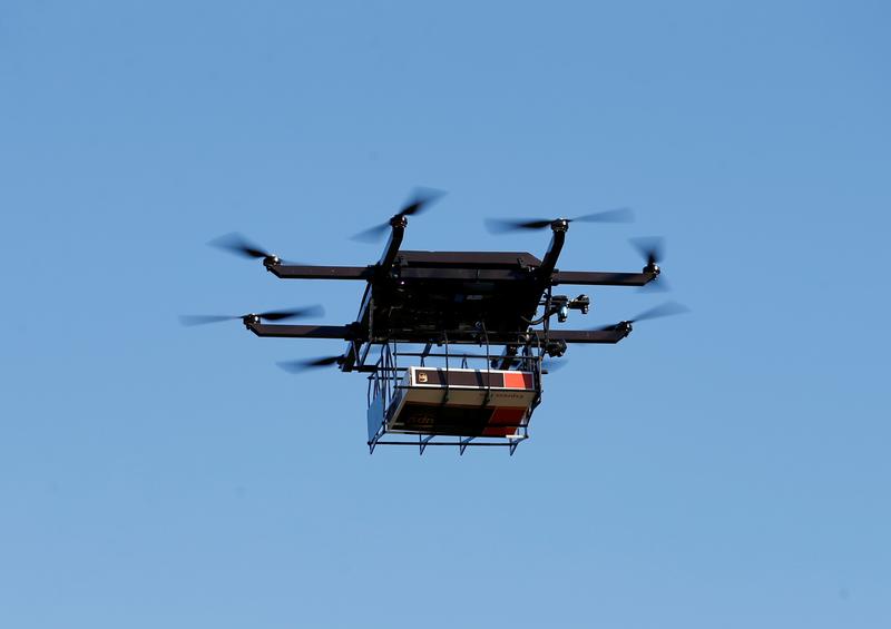 a drone demonstrates delivery capabilities from the top of a ups truck during testing in lithia florida us february 20 2017 photo reuters