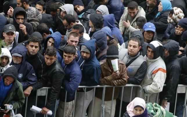 migrants queue in the compound outside the berlin office of health and social affairs lageso as they wait to register in berlin germany october 7 2015 photo reuters