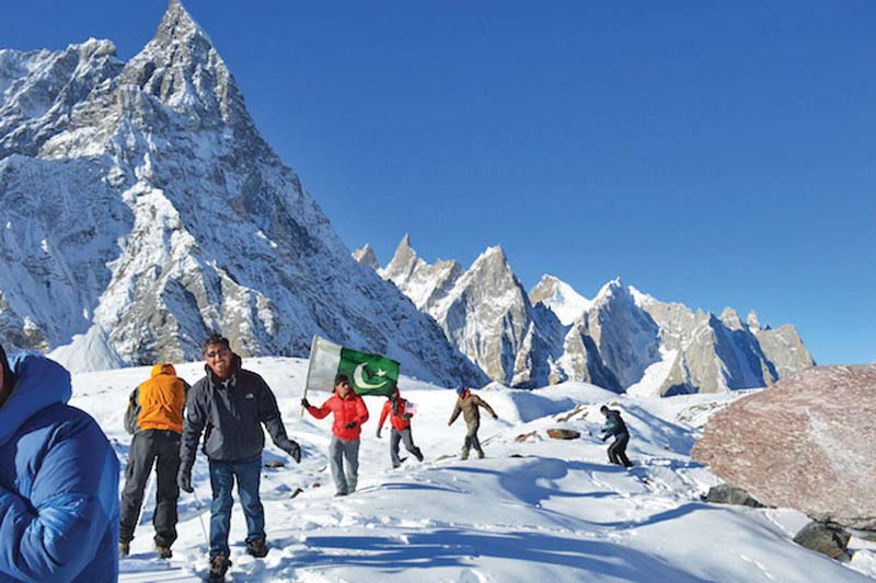 volunteers trekking up to concordia for clean up photo express