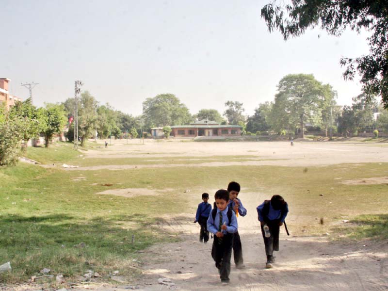 students walking across doongi ground samnabad photo abid nawaz express