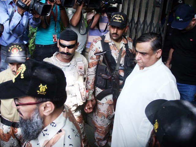 dr asim hussain in custody of rangers after an atc hearing in karachi on august 27 2015 photo online