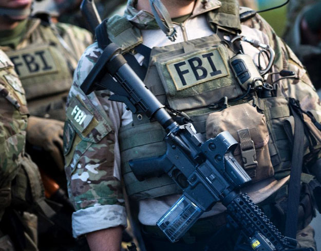 members of a federal bureau of investigation swat team take part in a field training exercise in alexandria virginia photo afp