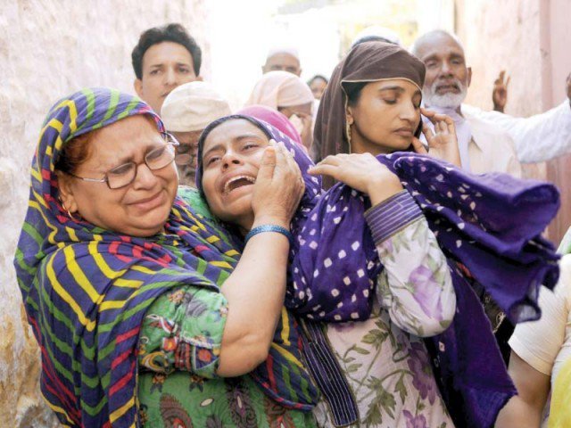 mohammad akhlaq s relatives mourn his death in the bisara village of uttar pradesh photo afp