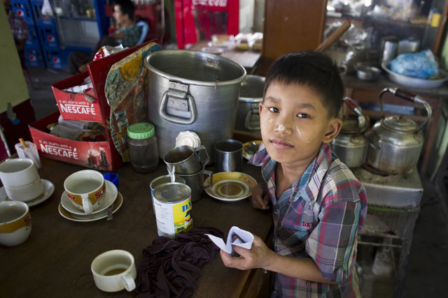 in this picture taken on october 21 2015 saw paing htway 11 works in a teashop on the outskirts of yangon photo afp