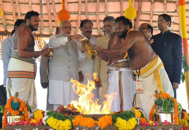 in this handout photograph released by the indian press information bureau pib on october 22 2015 indian prime minister narendra modi 2nd l performs a pooja ritual at the foundation stone laying ceremony in amaravati the new capital of andhra pradesh photo afp in this handout photograph released by the indian press information bureau pib on october 22 2015 indian prime minister narendra modi 2nd l performs a pooja ritual at the foundation stone laying ceremony in amaravati the new capital of andhra pradesh photo afp