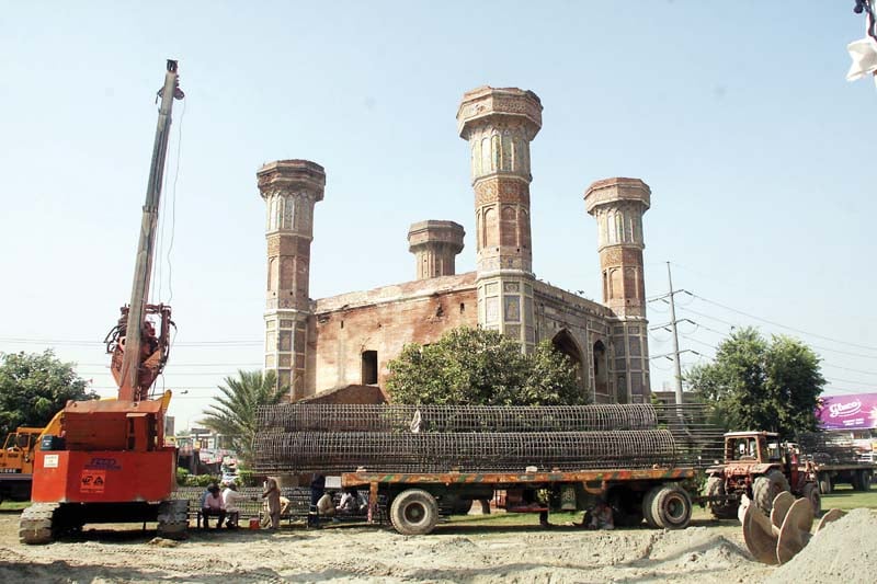 machinery for roadwork parked near chauburji photo abid nawaz express