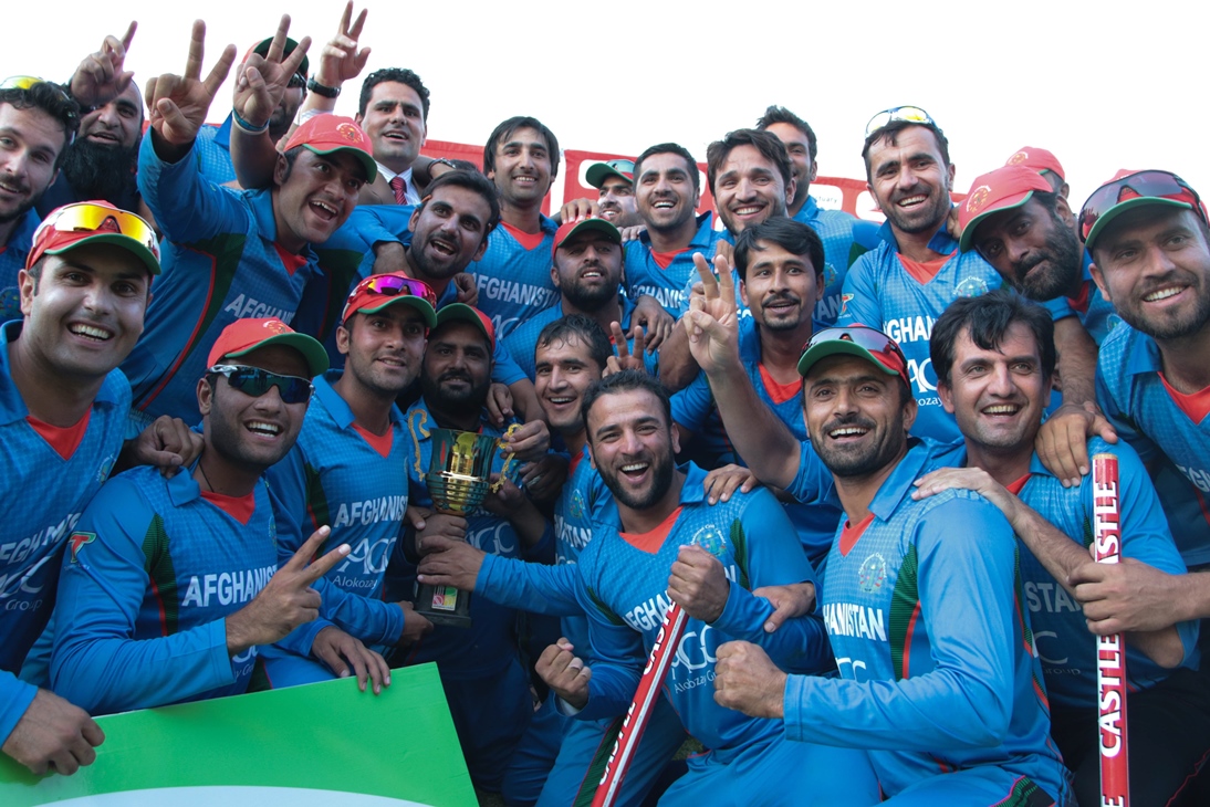 afghanistan 039 s players pose with the series trophy after they won the fifth and final one day international odi cricket match against zimbabwe at the queens sports club in bulawyo on october 24 2015 photo afp