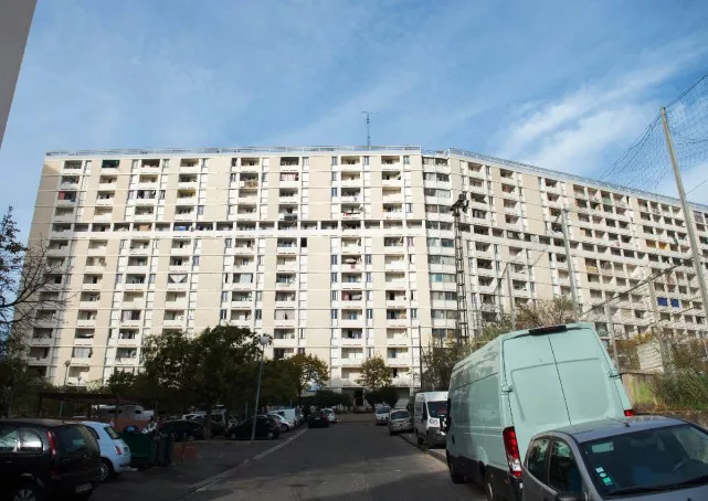 a picture taken on october 25 2015 in marseille southern france shows an apartment block of the cite des lauriers area where three men where shot dead photo afp a picture taken on october 25 2015 in marseille southern france shows an apartment block of the cite des lauriers area where three men where shot dead photo afp