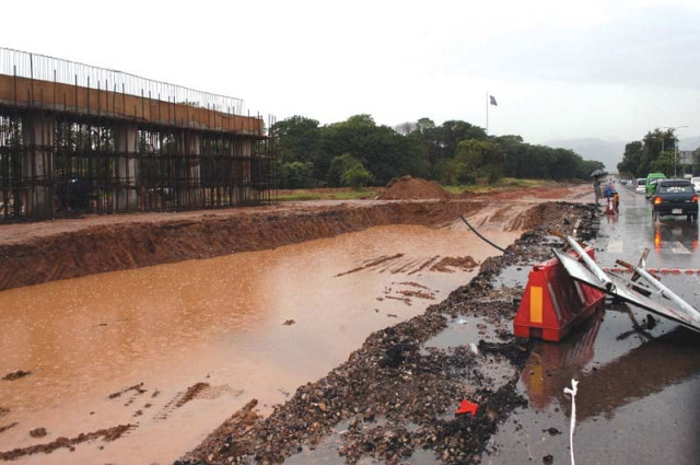 an iqbal town neighbourhood along with the under construction expressway expansion site stands flooded photos zafar aslam amp waseem nazir express
