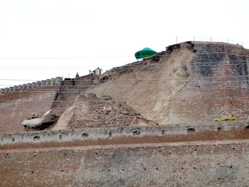 a view of the collapsed wall of the bala hissar fort after the earthquake photo afp