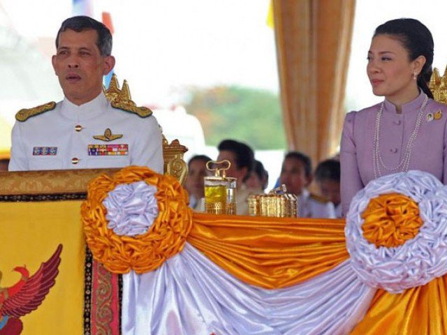 this file picture taken on may 13 2010 shows thai crown prince maha vajiralongkorn left and princess srirasmi right as they attend the annual royal ploughing ceremony at sanam luang in bangkok photo afp