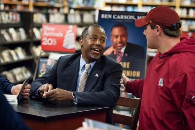 republican presidential candidate dr ben carson greets a supporter after signing a copy of his book 039 039 a more perfect union 039 039 as a part of his campaign and book tour at a store in ames iowa on october 24 2015 photo reuters