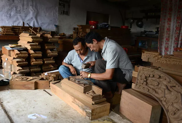 nepalese wood carver indra kaji shilpakar r teaches his son indra prasad shilpakar at his workshop in bhaktapur on the outskirts of kathmandu photo afp nepalese wood carver indra kaji shilpakar r teaches his son indra prasad shilpakar at his workshop in bhaktapur on the outskirts of kathmandu photo afp