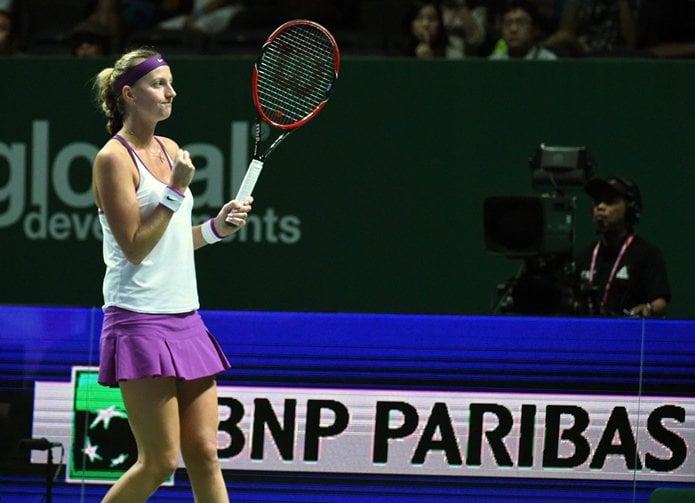 petra kvitova celebrates after defeating compatriot lucie safarova during their women 039 s singles round robin tennis match at the wta finals in singapore on october 28 2015 photo afp