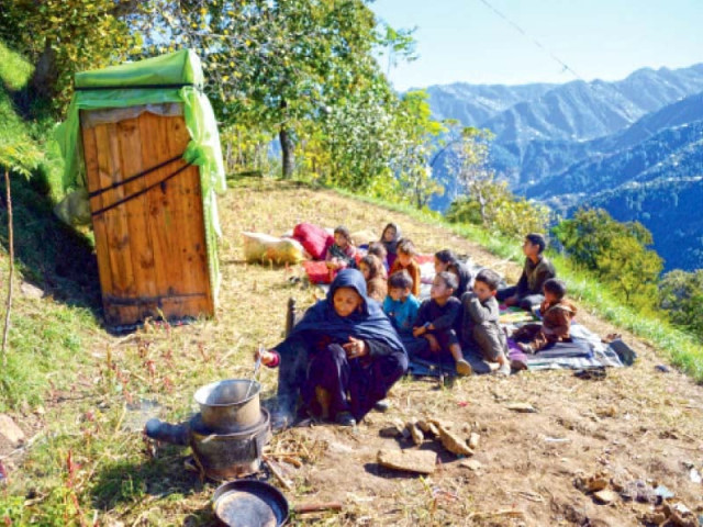 seventy year old gul subhana prepares food for her grandchildren in an open space in the quake hit shangla district photo afp seventy year old gul subhana prepares food for her grandchildren in an open space in the quake hit shangla district photo afp