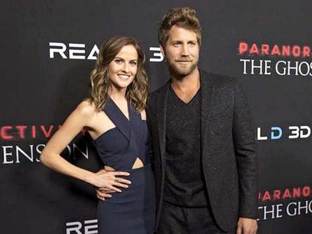 cast members chris j murray and brit shaw pose at the premiere of paranormal activity the ghost dimension in hollywood california photo reuters cast members chris j murray and brit shaw pose at the premiere of paranormal activity the ghost dimension in hollywood california photo reuters