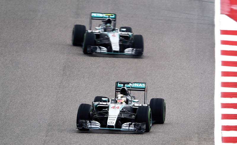 hamilton and rosberg clashed on lap one before the briton secured a bold title clinching triumph photo afp