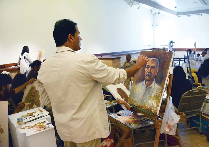 a participant paints at the portrait competition held at pnca photo huma choudhary express