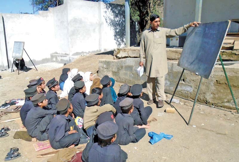 students of government primary school study under the open sky photo inp