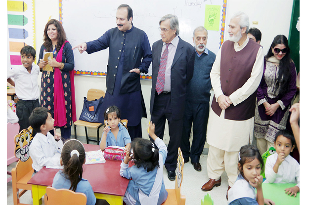 education minister rana mashhood seen talking to students on the ocassion photo nni