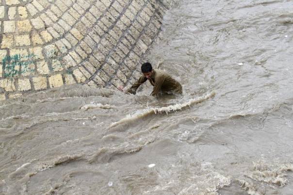 in this file 2012 photo a boy tries to get out of a flooded street following heavy rains in sanaa yemen photo reuters