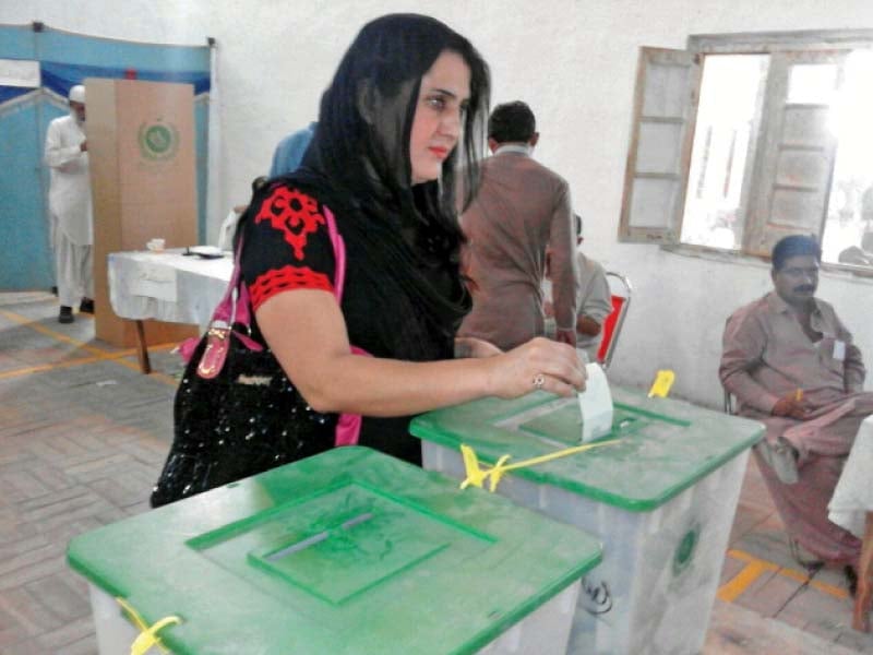 sanam fakir casts her vote in the railway officer s club polling station on saturday photo express