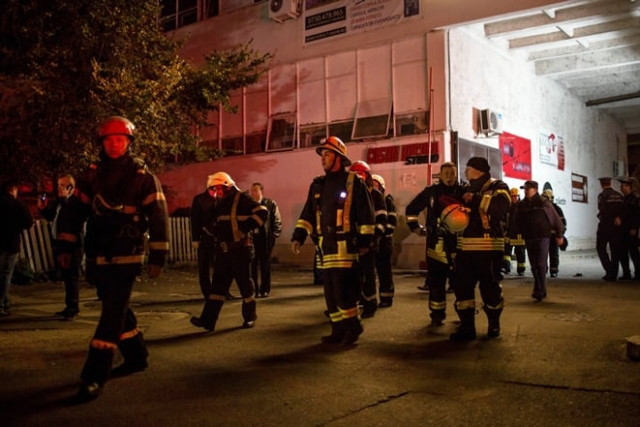 emergency services gather near a club in bucharest after an explosion on october 31 2015 photo afp