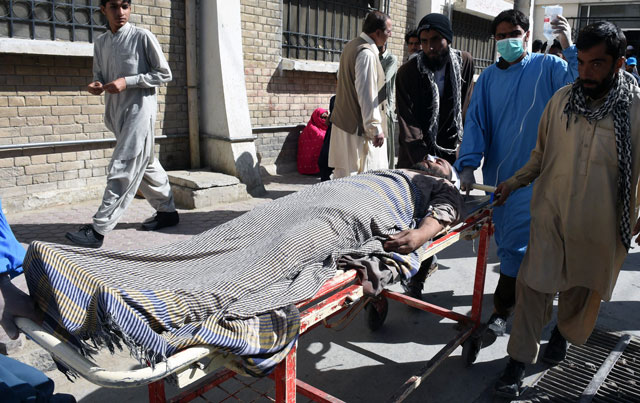 volunteers push a stretcher carrying an injured blast victim to a hospital in quetta on november 1 2015 following a bomb explosion in a passenger train in mastung balochistan photo afp