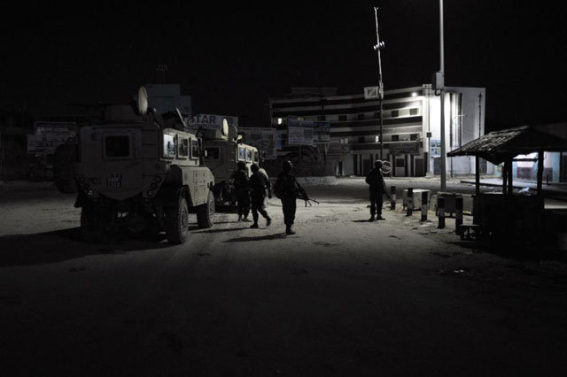 soldiers from the african union mission in somalia standing guard at the k4 roundabout in mogadishu photo afp