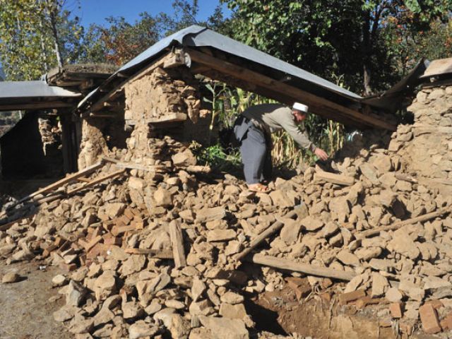 some survivors are left with no option but to destroy whatever remains of their damaged houses photo afp