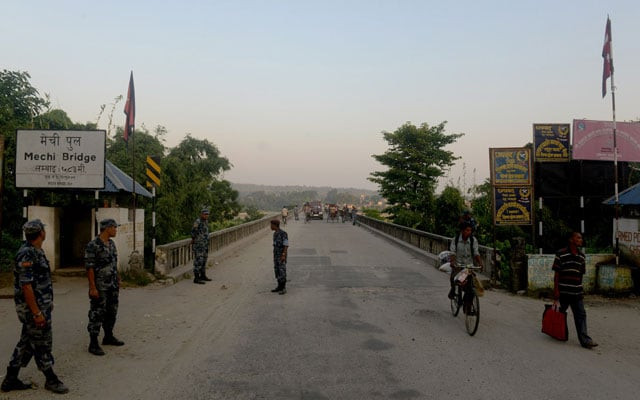 in this photograph taken on september 30 2015 nepalese security personnel stand guard at an entry point to nepal from india at mechinagar on the eastern nepalese border with india photo afp in this photograph taken on september 30 2015 nepalese security personnel stand guard at an entry point to nepal from india at mechinagar on the eastern nepalese border with india photo afp